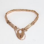 A Vintage 9ct gold gate link heart padlock bracelet, bracelet length 17cm, 13.3g No damage or