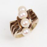 MIKIMOTO - an Art Deco style 14ct gold pearl dress ring, openwork stylised shoulders, setting height