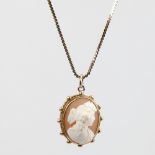 A Victorian high relief carved cameo shell pendant necklace, depicting Classical female profile,