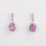 A modern pair of 14ct white gold pink sapphire and diamond cluster drop earrings, set with oval