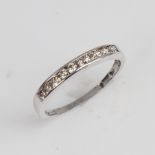 A modern 9ct white gold diamond half eternity ring, set with modern round brilliant-cut diamonds,