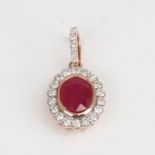 A modern 14ct rose gold ruby and diamond cluster pendant, set with oval mixed-cut ruby and round