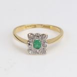 An early 20th century unmarked gold and platinum emerald and diamond cluster ring, set with