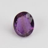 A 5.46ct unmounted oval mixed-cut amethyst, dimensions: 12.40mm x 9.99mm x 6.64mm, 1.09g, with GJSPC