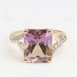 A modern 9ct gold ametrine and CZ dress ring, ametrine length 11mm, size L, 2.5g No damage or