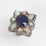 A large modern oxidised silver sapphire opal and diamond star ring, openwork set with oval mixed-cut