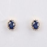 A modern pair of 14ct gold sapphire and diamond cluster stud earrings, set with oval mixed-cut