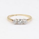 An early 20th century 18ct gold 3-stone diamond ring, set with round brilliant and old-cut diamonds,