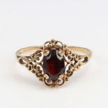 A late 20th century 9ct gold garnet dress ring, setting height 11.3mm, size N, 1.4g No damage or