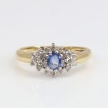 A late 20th century 18ct gold sapphire and diamond cluster ring set with oval mixed-cut sapphire and