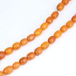 A Vintage single-row butterscotch amber bead necklace, bead length approx 14.8mm, necklace length