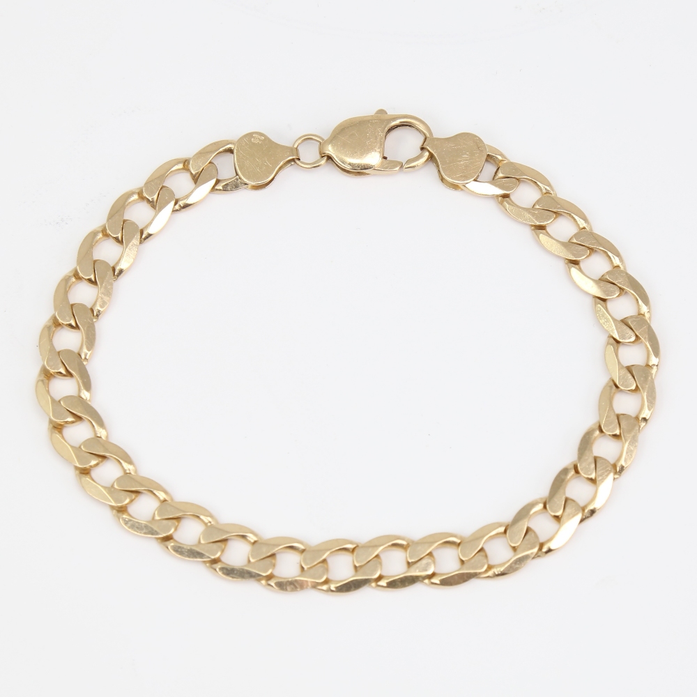 A late 20th century 9ct gold flat curb link bracelet, bracelet length 22cm, 18.9g No damage or