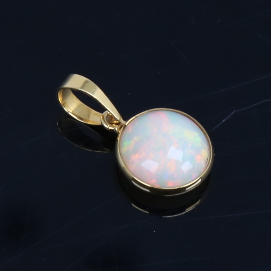 A modern handmade unmarked gold Ethiopian opal pendant, set with round cabochon opal, settings - Image 3 of 5