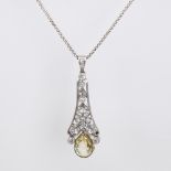A Belle Epoque natural Ceylon yellow sapphire and diamond pendant necklace, unmarked white metal