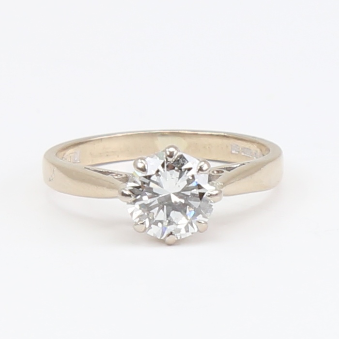 An 18ct gold 1.05ct solitaire diamond ring, modern round brilliant-cut diamond within plain 8-claw