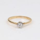 An 18ct gold 0.1ct solitaire diamond ring, modern round brilliant-cut diamond in illusion style