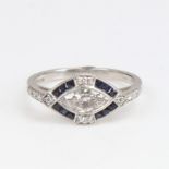 An Art Deco style platinum sapphire and diamond geometric panel ring, set with marquise and round