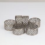 A set of 6 unmarked silver napkin rings, pierced foliate decoration, band width 2.5cm, internal