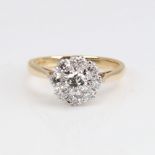 A late 20th century 18ct gold diamond cluster ring, set with modern round brilliant and eight-cut