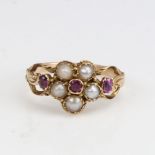 A Victorian unmarked gold split-pearl and ruby cluster memorial ring, central flowerhead design with