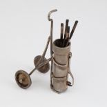 An Elizabeth II novelty silver miniature set of golf clubs and caddy, by Edward Victor Stanley,