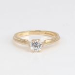 A modern 14ct gold solitaire cubic zirconia ring, set with modern round brilliant-cut CZ, diameter