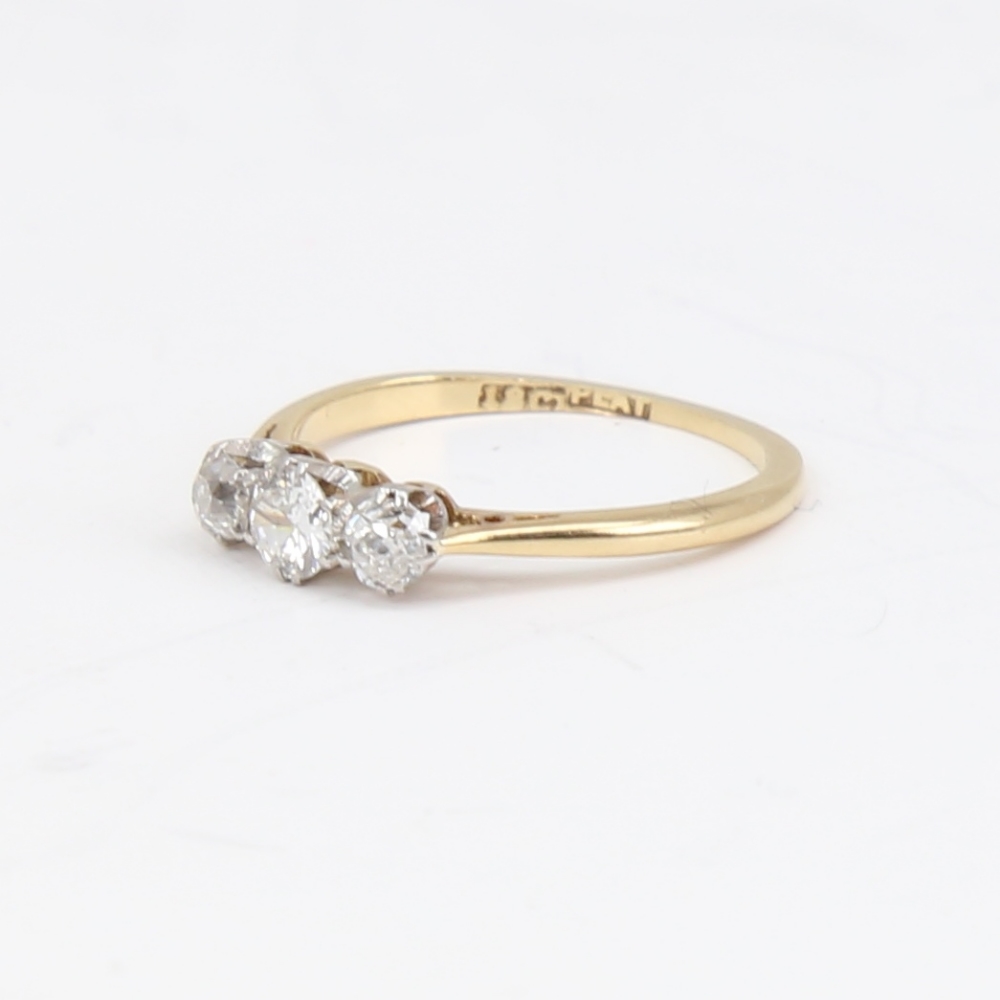 An early 20th century 18ct gold 3-stone diamond ring, set with round brilliant and old-cut diamonds, - Image 2 of 5