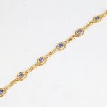 An Art Deco style 18ct gold sapphire and diamond bracelet, geometric design set with oval mixed-