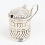 A Victorian silver mustard pot, formed as a tankard, half fluted form with blue glass liner, by