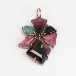 A modern handmade unmarked silver vari-hue tourmaline pendant, set with fantasy-cut tourmalines,