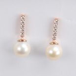 A modern pair of 14ct rose gold whole cultured pearl and diamond drop earrings, set with a line of