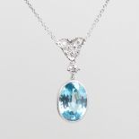 A platinum zircon and diamond pendant necklace, set with 9ct oval mixed-cut zircon drop and round