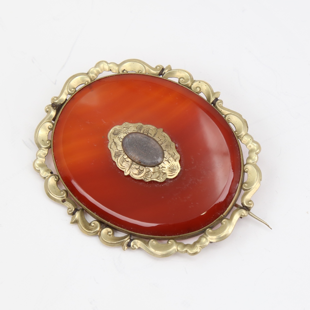 A large Victorian oval mourning brooch, unmarked yellow metal settings with red banded agate and - Image 4 of 5