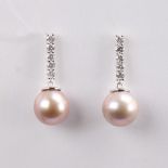A modern pair of 14ct white gold Southsea pearl and diamond drop earrings, set with whole pink