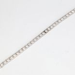 A fine Vintage 18ct white gold diamond line bracelet, set with 32 modern round brilliant-cut
