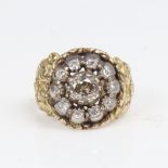 A large 19th century unmarked gold diamond cluster ring, set with old-cut diamonds and relief floral