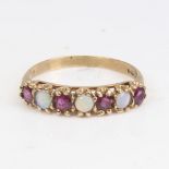 A late 20th century 9ct gold 7-stone opal and garnet half hoop ring, set with round cabochon opals