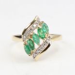 A modern 9ct gold emerald and diamond dress ring, set with marquise-cut emeralds and eight-cut