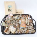 A tray of various coins and banknotes