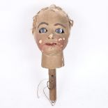 An Antique painted papier mache ventriloquist puppet head, with moving mouth and eyes, head height