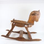 A Vintage carved wood rocking horse, height 59cm