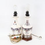 A pair of porcelain table lamps on stands, height 50cm overall
