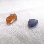 2 unmounted gemstones, comprising 3.53ct tanzanite, and 5.29ct yellow topaz, with GJSPC Gemstone