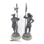 A pair of spelter knight guard sculptures, on green speckled marble bases, unsigned, largest