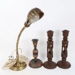 A pair of Burmese carved hardwood lamp bases, Kashmiri lacquered painted and gilded lamp base, and a