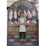 A large carved and painted wood butcher's advertising sign, Mr Teds Famous Pork Sausages, 92cm x