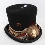 A Charlie Horse top hat, decorated with animal skull, fur and feathers