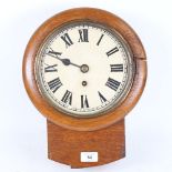 An early 20th century oak-cased drop-dial 30-hour wall clock, Roman numeral hour markers, dial