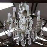 A large distressed wrought-metal 8-branch chandelier, with glass drops, branch length 27cm,