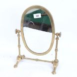 An Antique brass-framed dressing table swivel mirror, height 35cm